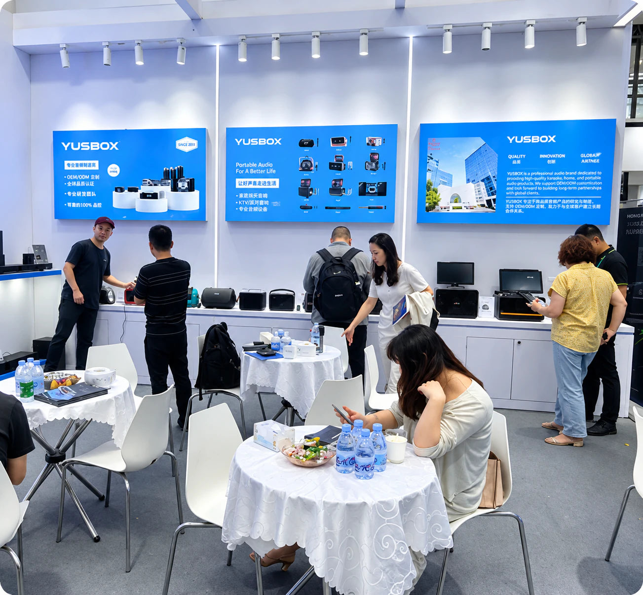 Visitors exploring YUSBOX karaoke products at IFA Berlin 2024